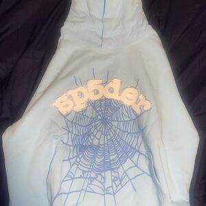 This Sp5der Web Hoodie from in a light blue colorway the brand calls 'Sky Blue